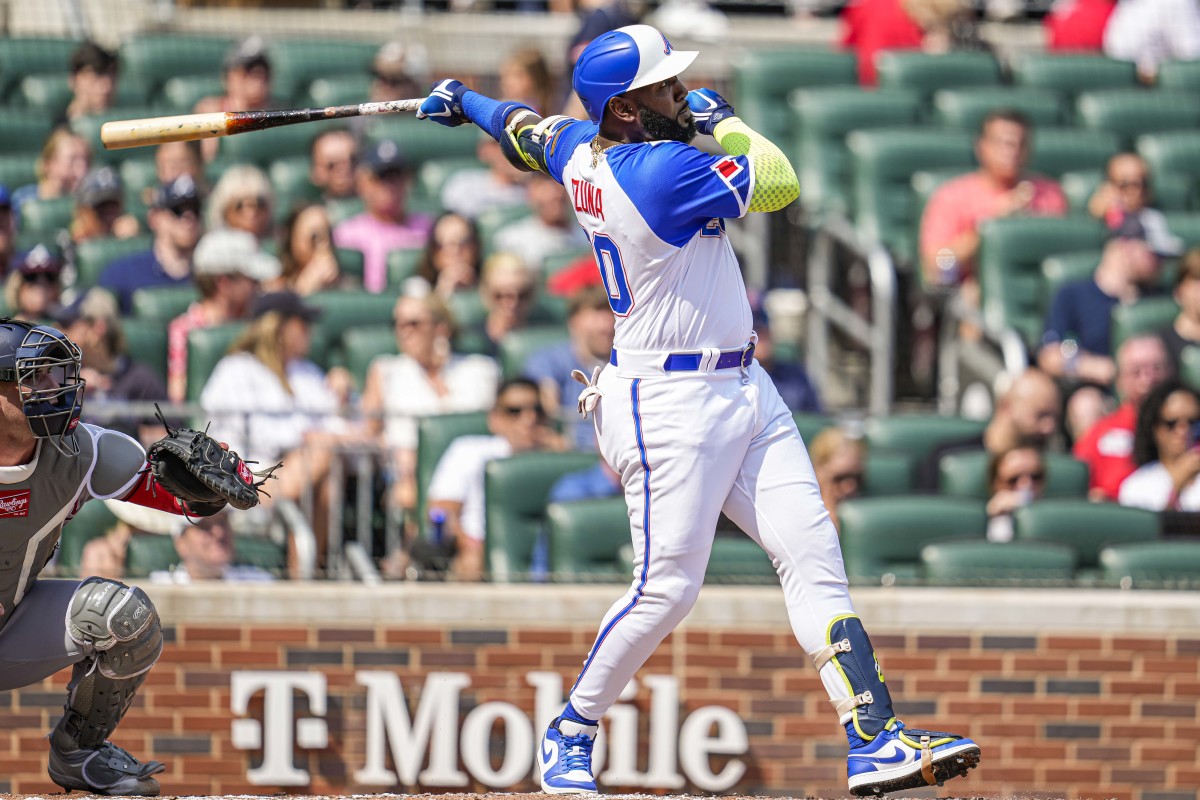 Jun 10, 2023; Cumberland, Georgia, USA; Atlanta Braves designated hitter Marcell Ozuna (20) hits a home run against the Washington Nationals during the second inning at Truist Park. Mandatory Credit: Dale Zanine-USA TODAY Sports